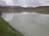 Tibet Kailash 11 Back 04 Yarlung Tsangpo We stopped briefly to admire the fairly wide, meandering Yarlung Tsangpo (Brahmaputra) River. The 2900km-long river rises to the east of Kailash, travels 1700km across Tibet at an average height of 4000m, takes a U-turn at Mount Nancha Barwa, descends rapidly through the Yarlung Tsangpo gorges (the deepest in the world), and then exits at the Bay of Bengal.